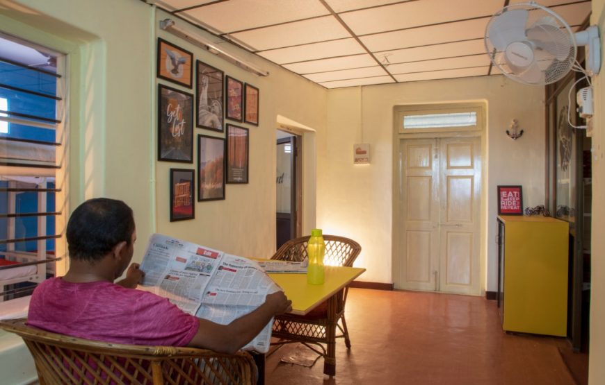 A visitor reading the newspaper in Decostel Coimbatore