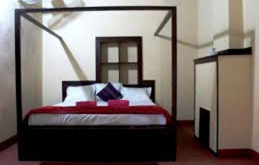 A well cushioned bed in coorg bungalow stay